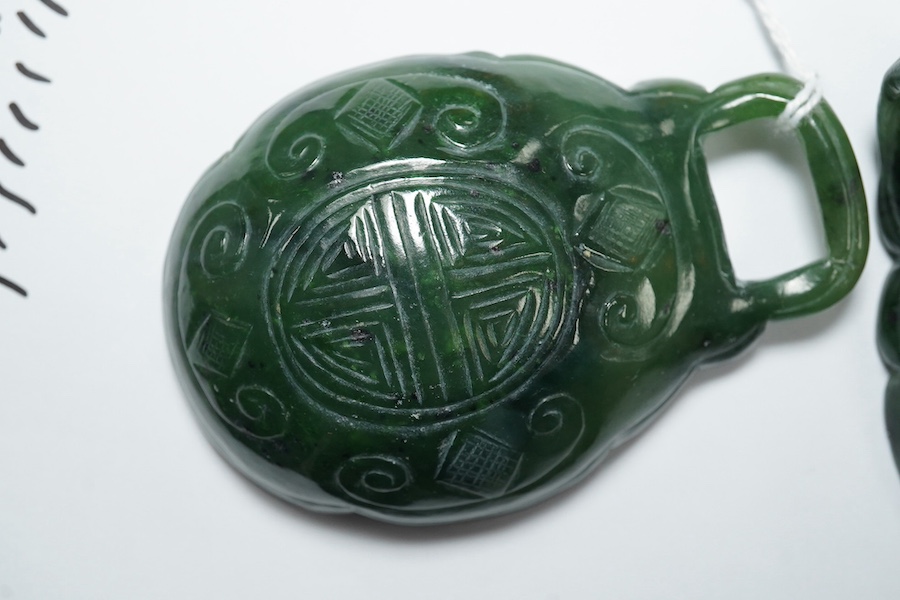 A Chinese spinach green jade two-piece belt buckle, 18th/19th century